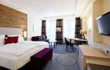 Четырёхместный номер Comfort с балконом и с видом на сад